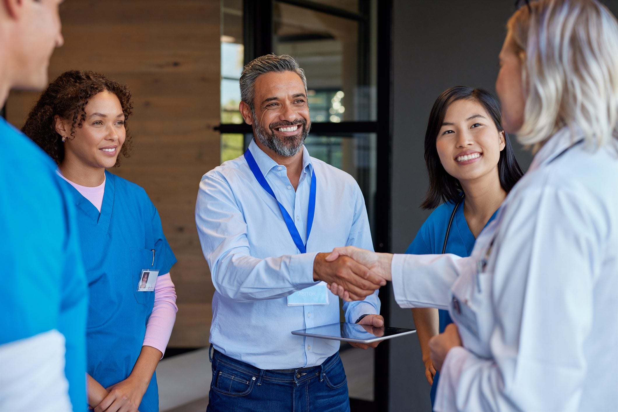 A provider greeting an employer group