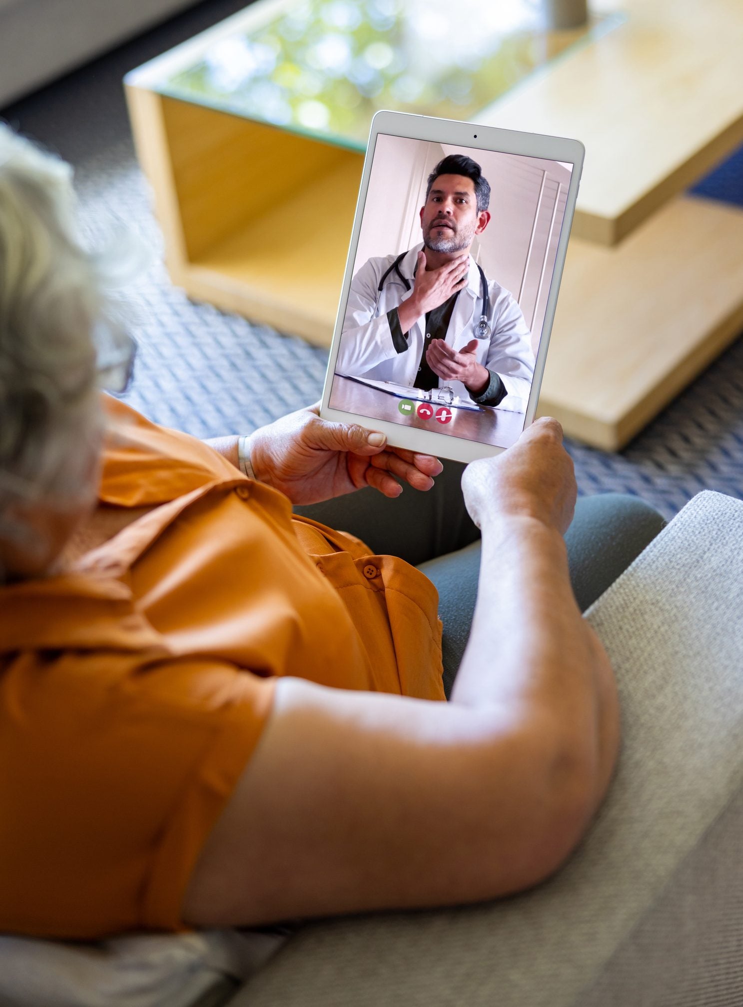 A member on a video visit with her provider