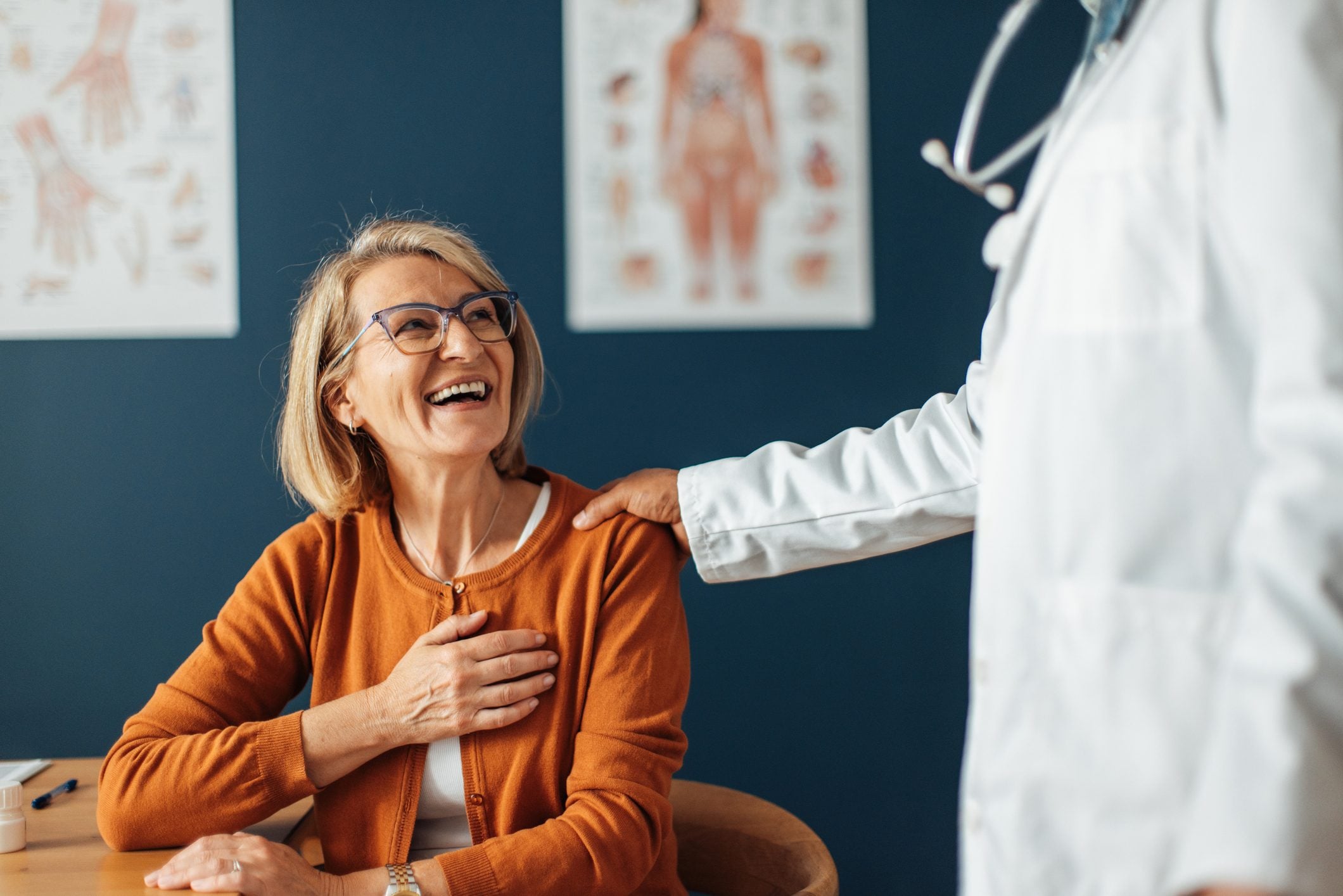 A member laughing with her provider